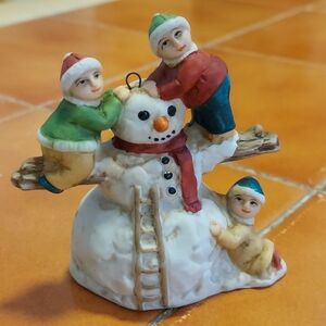 Childen Building Snowman Figurine
